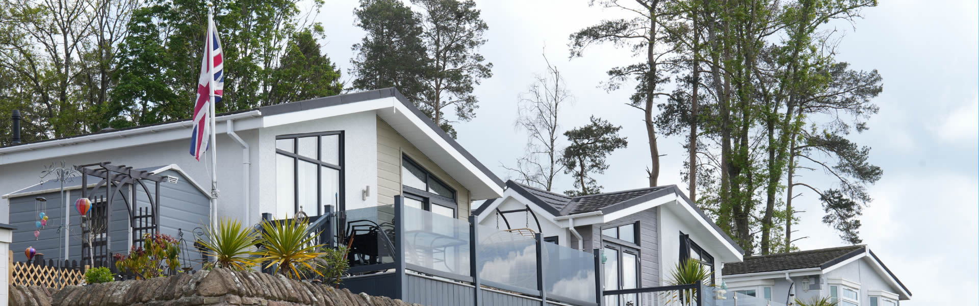 Residential park home surrounded by autumn trees